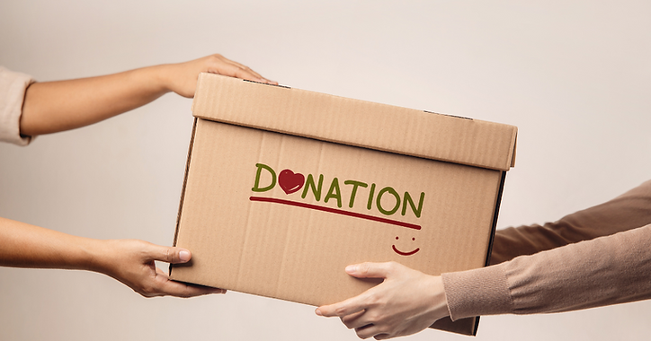 Two people exchanging a cardboard box labelled "DONATION" with a red heart as the "O" and a small smiley face below—a warm gesture perfect for celebration of life ideas or thoughtful memorial ideas. by H Parsons Funeral Directors